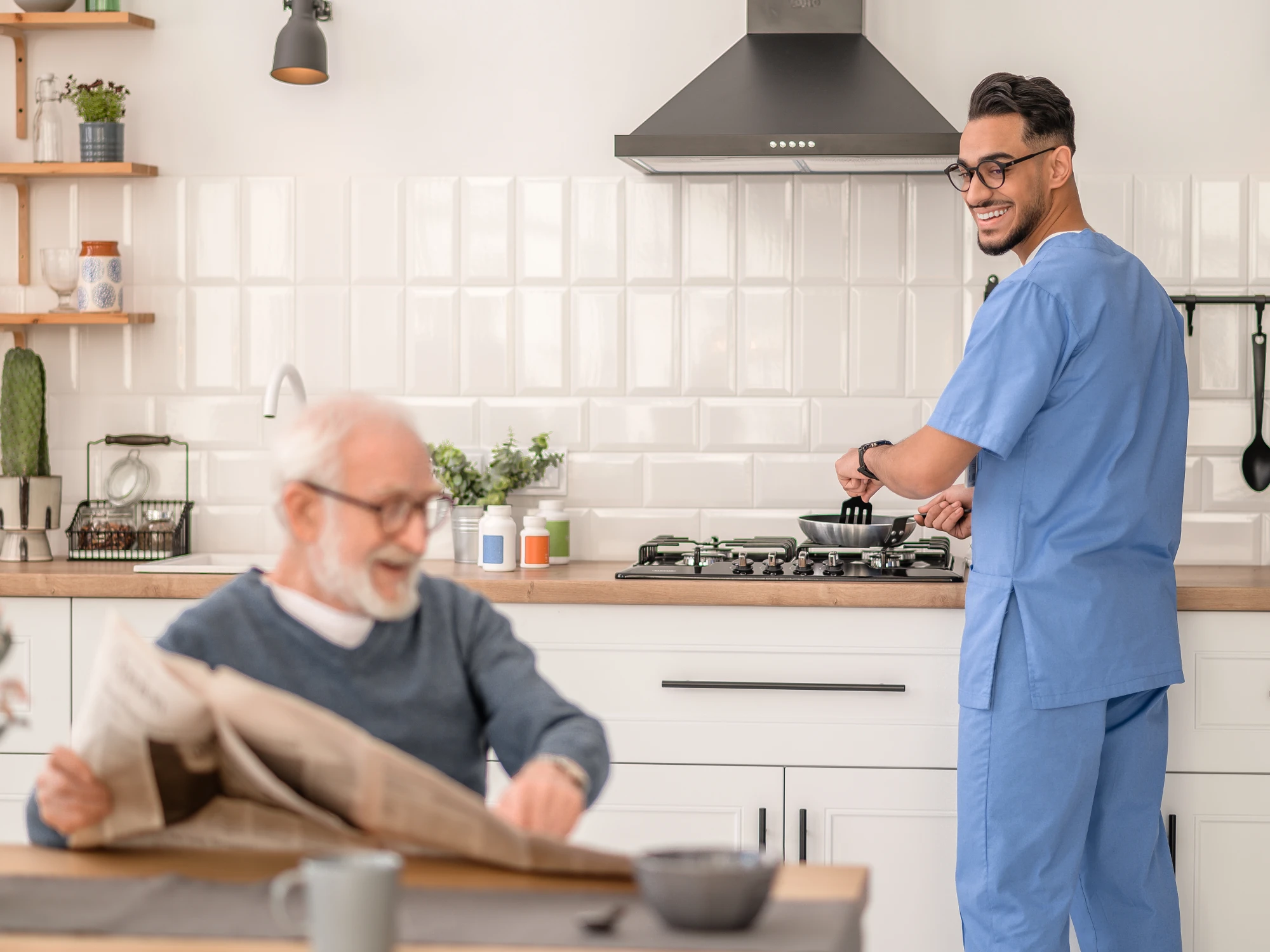 Caregiver assisting senior with meal at table, supporting home & community assistance.